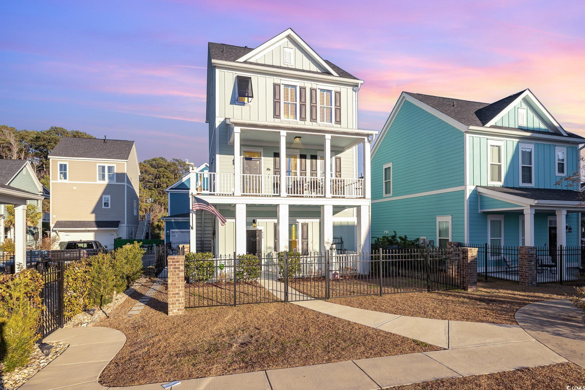 View of front of property with a balcony
