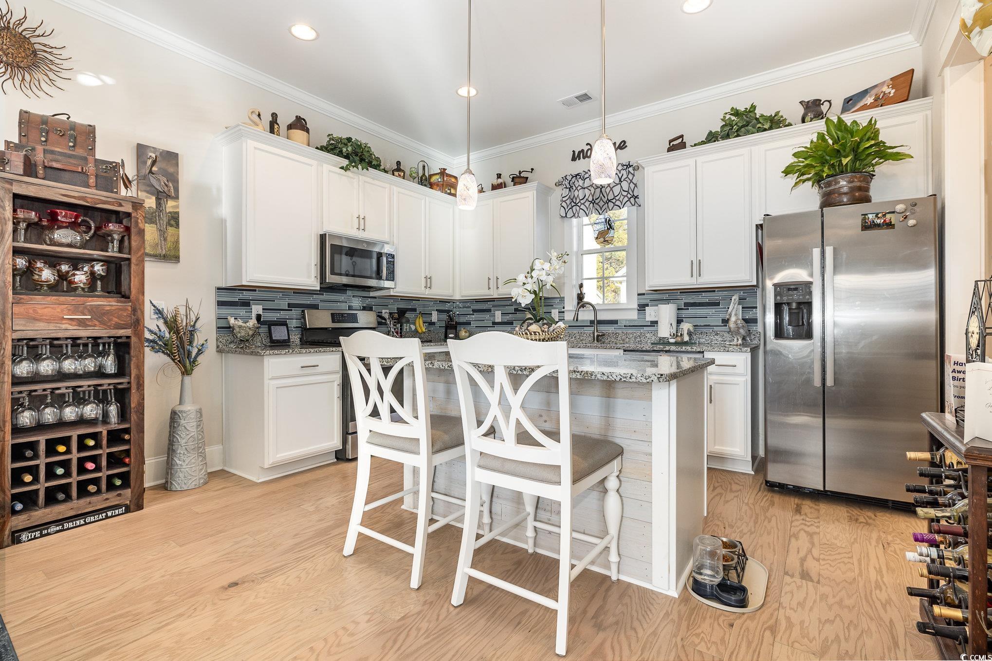 839 Rosa Circle Myrtle Beach, SC 29577 - Photo 11 of 40 Kitchen featuring light stone countertops, applian