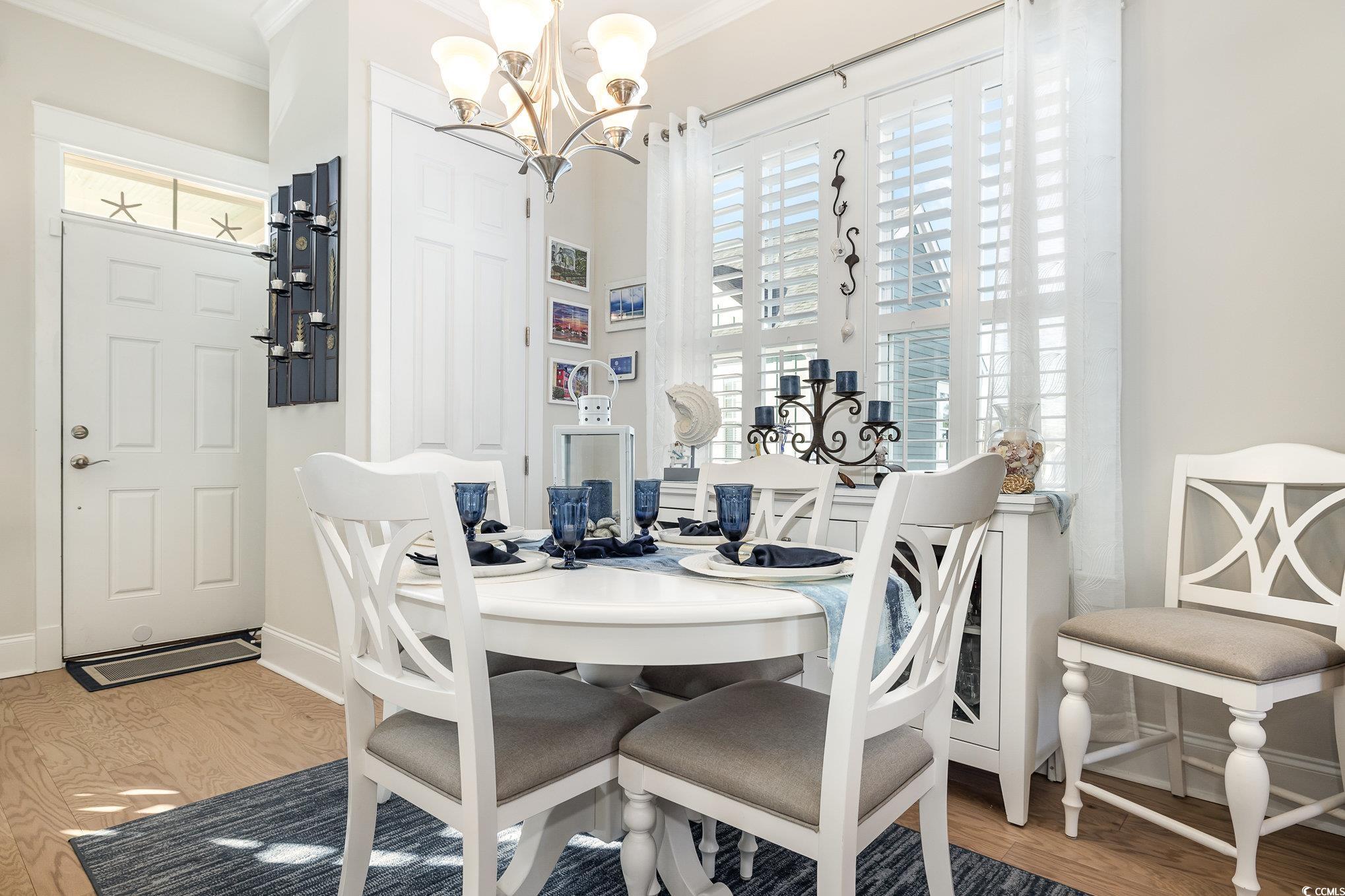 839 Rosa Circle Myrtle Beach, SC 29577 - Photo 9 of 40 Dining room with a chandelier, hardwood / wood-sty