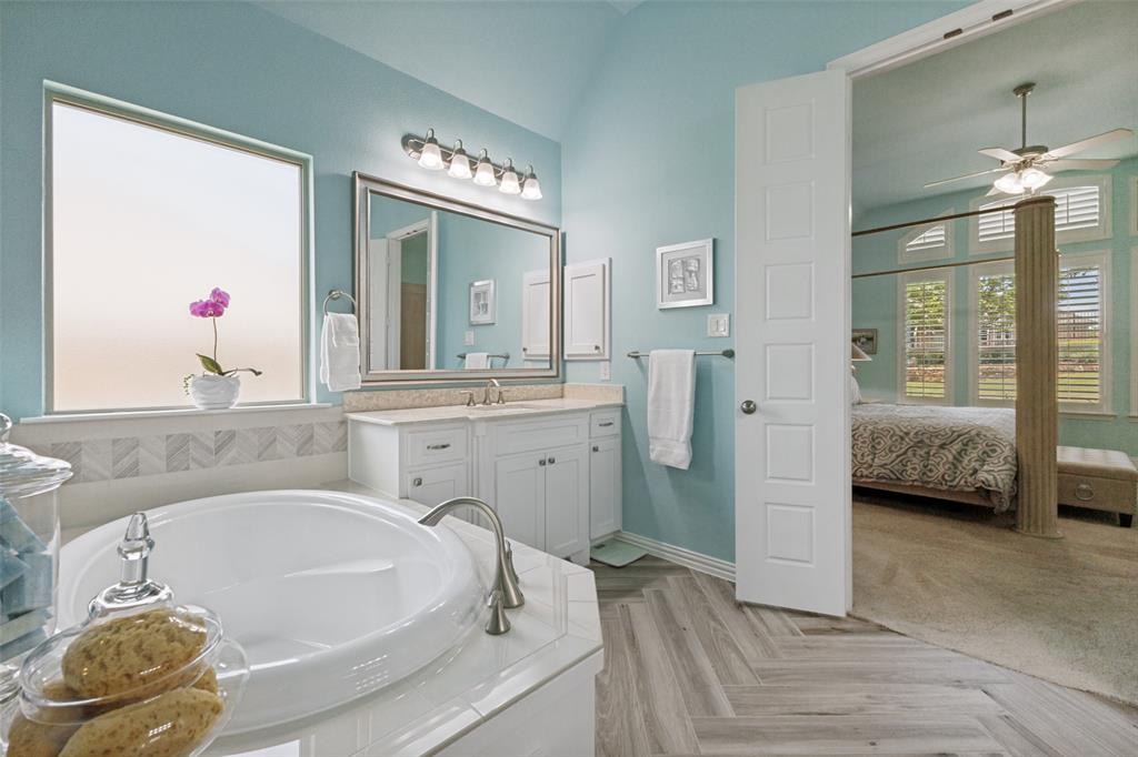 506 Life Spring Drive Rockwall, TX 75087 - Photo 23 of 36 a en suite spacious bathroom with a tub and a mirror
