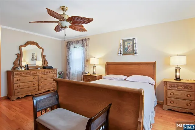 a bed room with a bed and a dresser