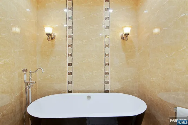 a bathroom with a shower and a sink