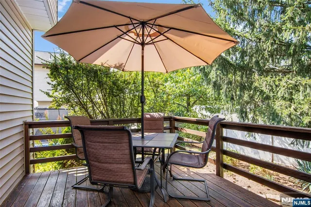 a view of an outdoor sitting area with furniture and umbrella