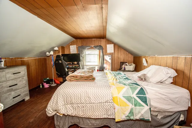 a bedroom with furniture and a bed