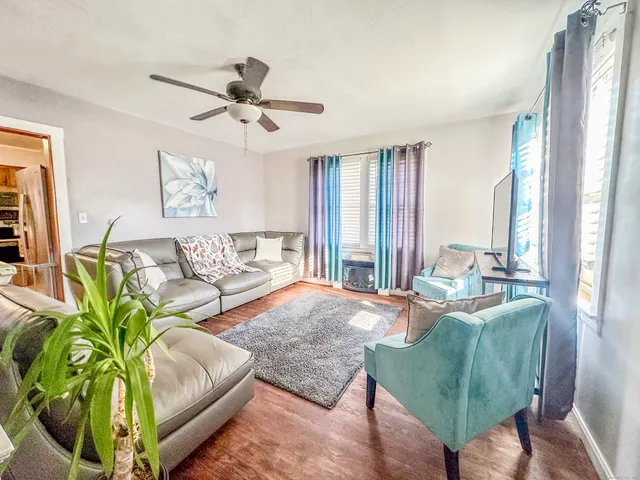 a living room with furniture and a large window