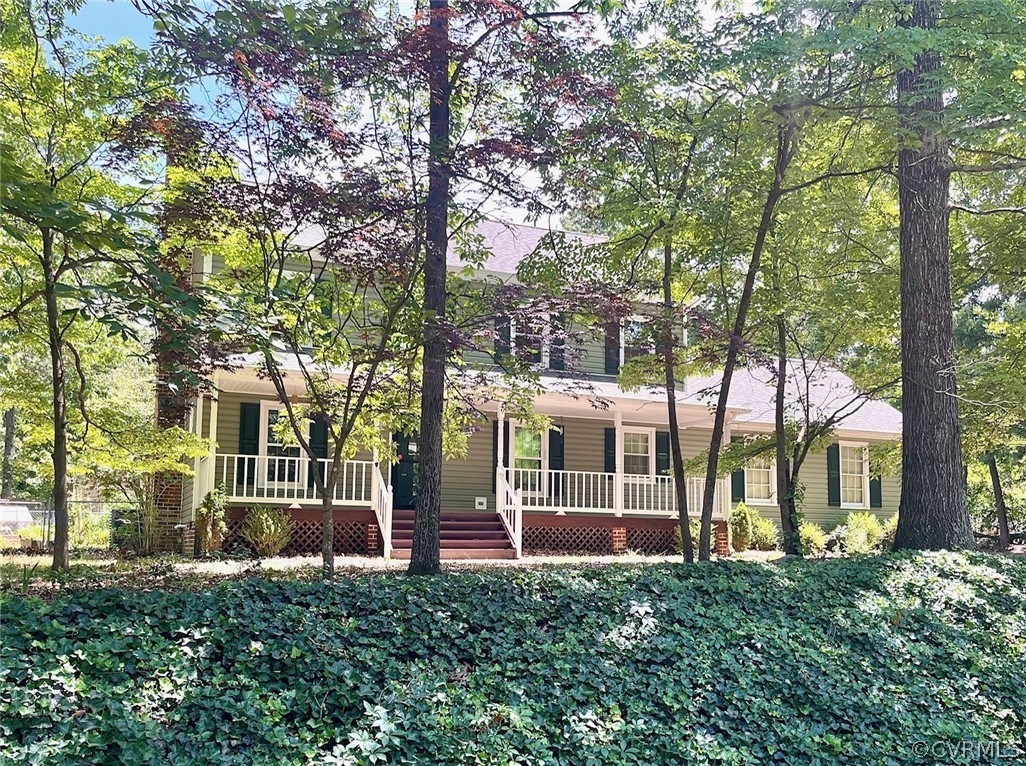 11001 Crofton Road Chester, VA 23831 - Photo 1 of 31 a view of a house with a large tree