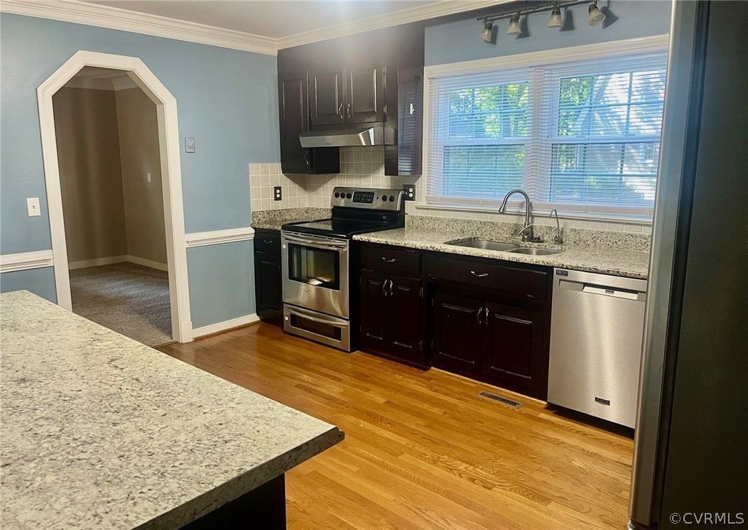 11001 Crofton Road Chester, VA 23831 - Photo 13 of 31 a kitchen with stainless steel appliances granite countertop a sink stove and refrigerator