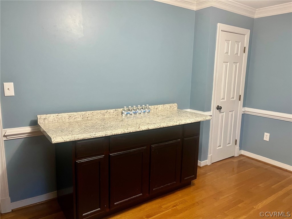 11001 Crofton Road Chester, VA 23831 - Photo 14 of 31 a kitchen with a sink cabinets and a wooden floor