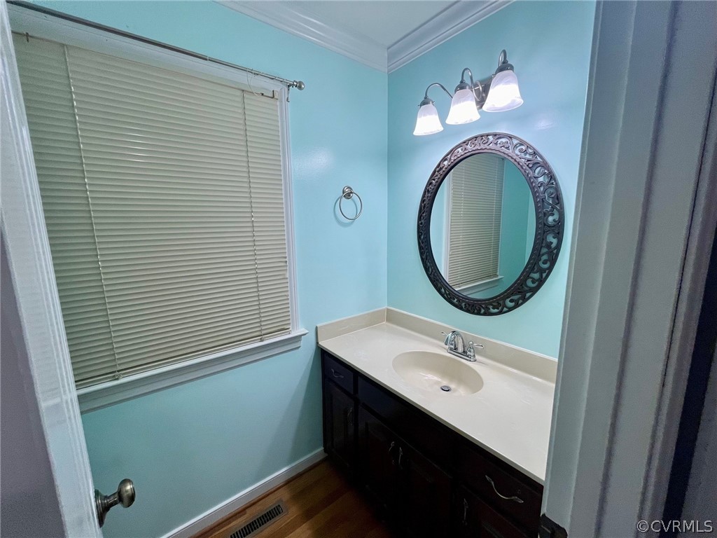 11001 Crofton Road Chester, VA 23831 - Photo 24 of 31 a bathroom with a sink and a mirror