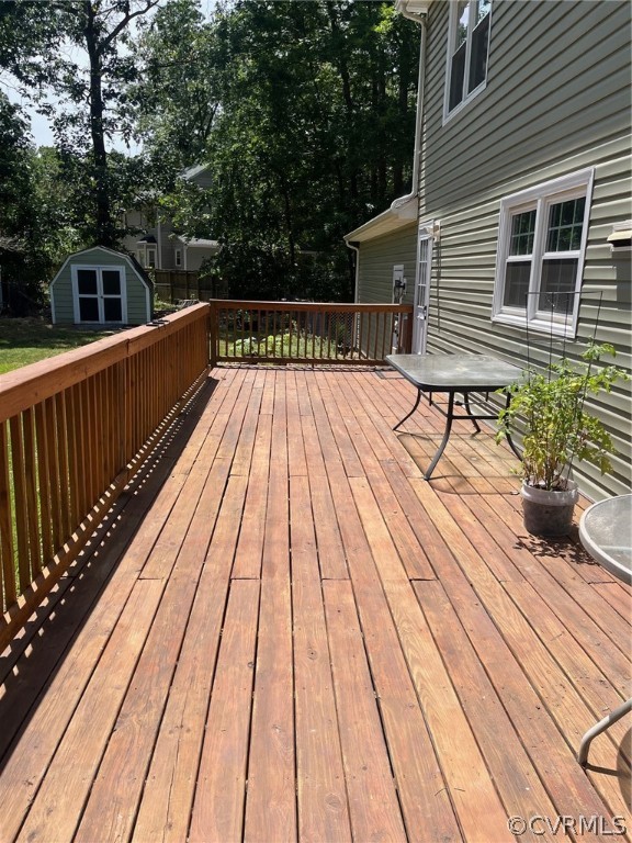 11001 Crofton Road Chester, VA 23831 - Photo 5 of 31 a view of balcony with wooden floor and large trees