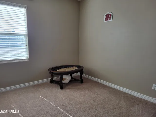 a bathroom with a granite countertop sink a toilet a mirror and shower