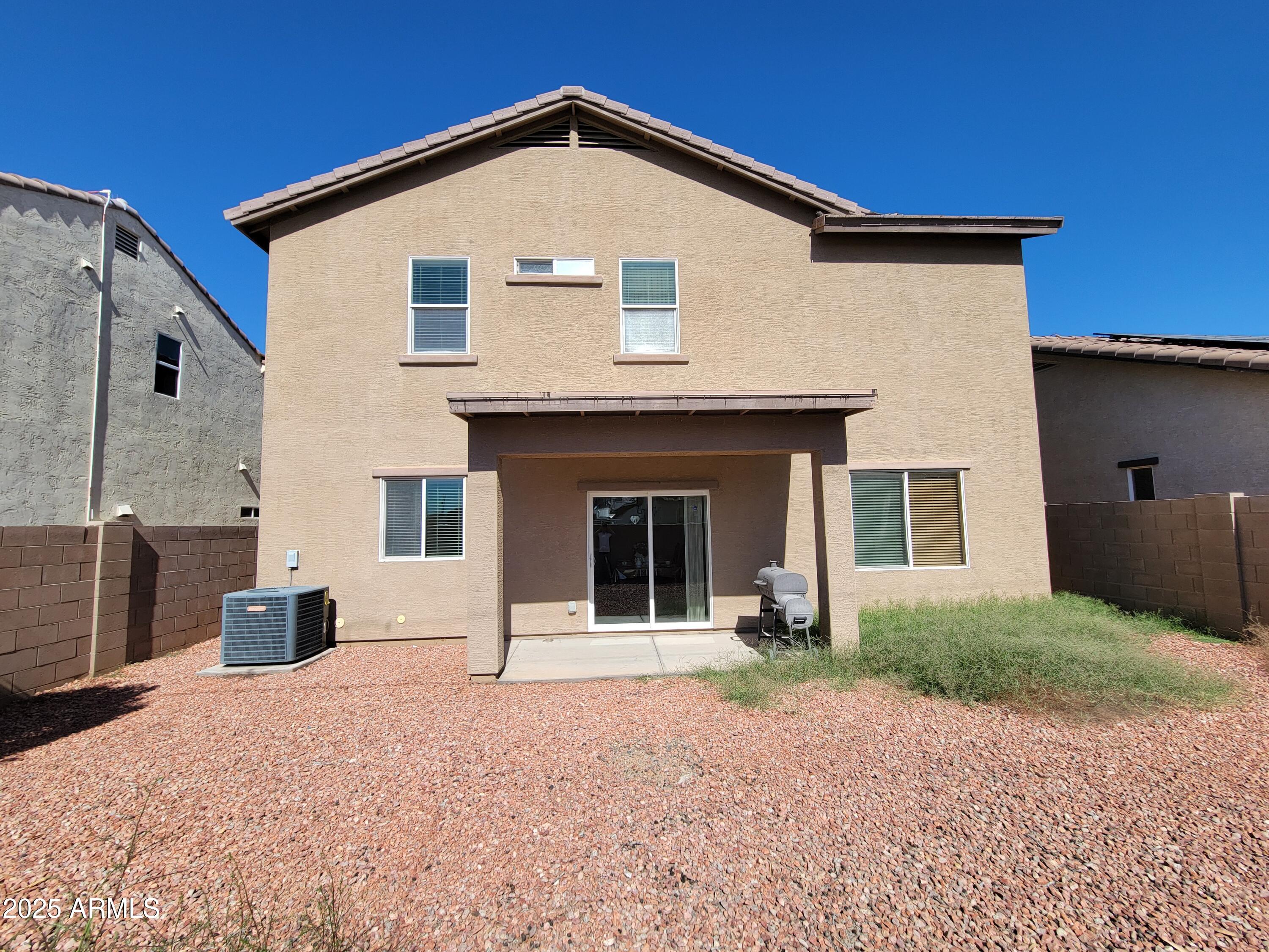 7439 West Wolf Street Phoenix, AZ 85033 - Photo 20 of 21 a front view of a house with a yard