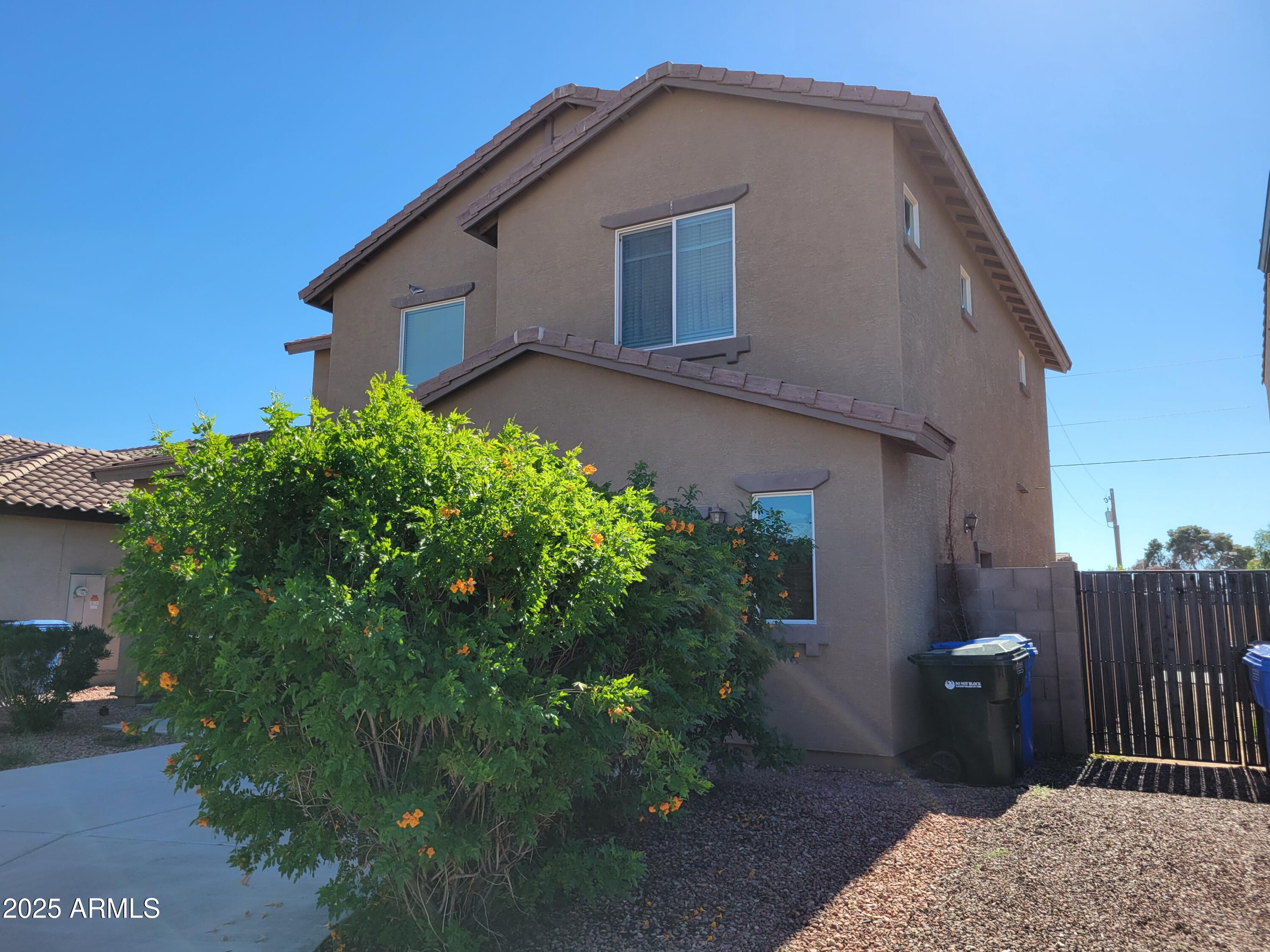 7439 West Wolf Street Phoenix, AZ 85033 - Photo 2 of 21 a backyard of a house with lots of green space
