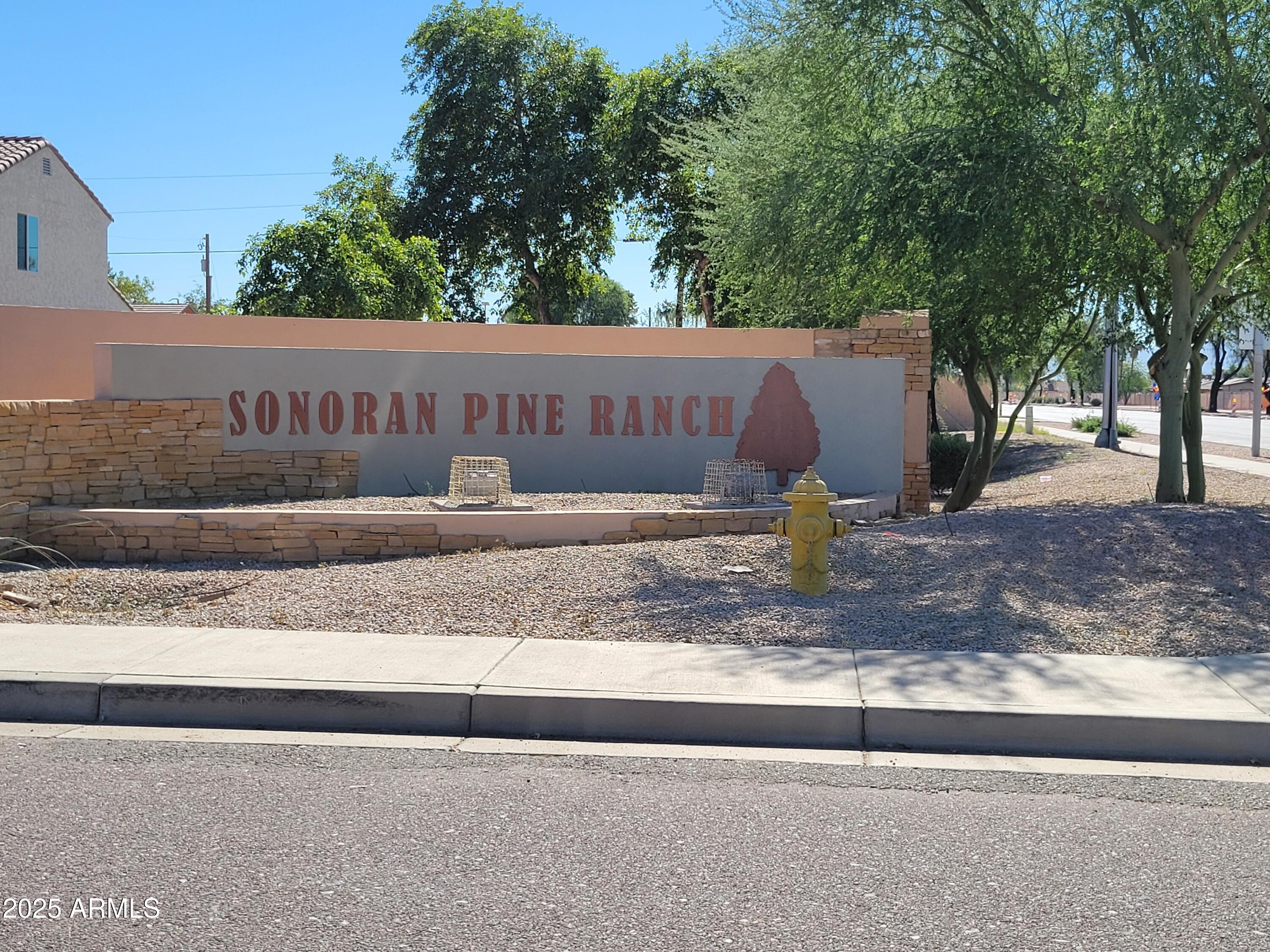 7439 West Wolf Street Phoenix, AZ 85033 - Photo 21 of 21 a view of a wooden fence