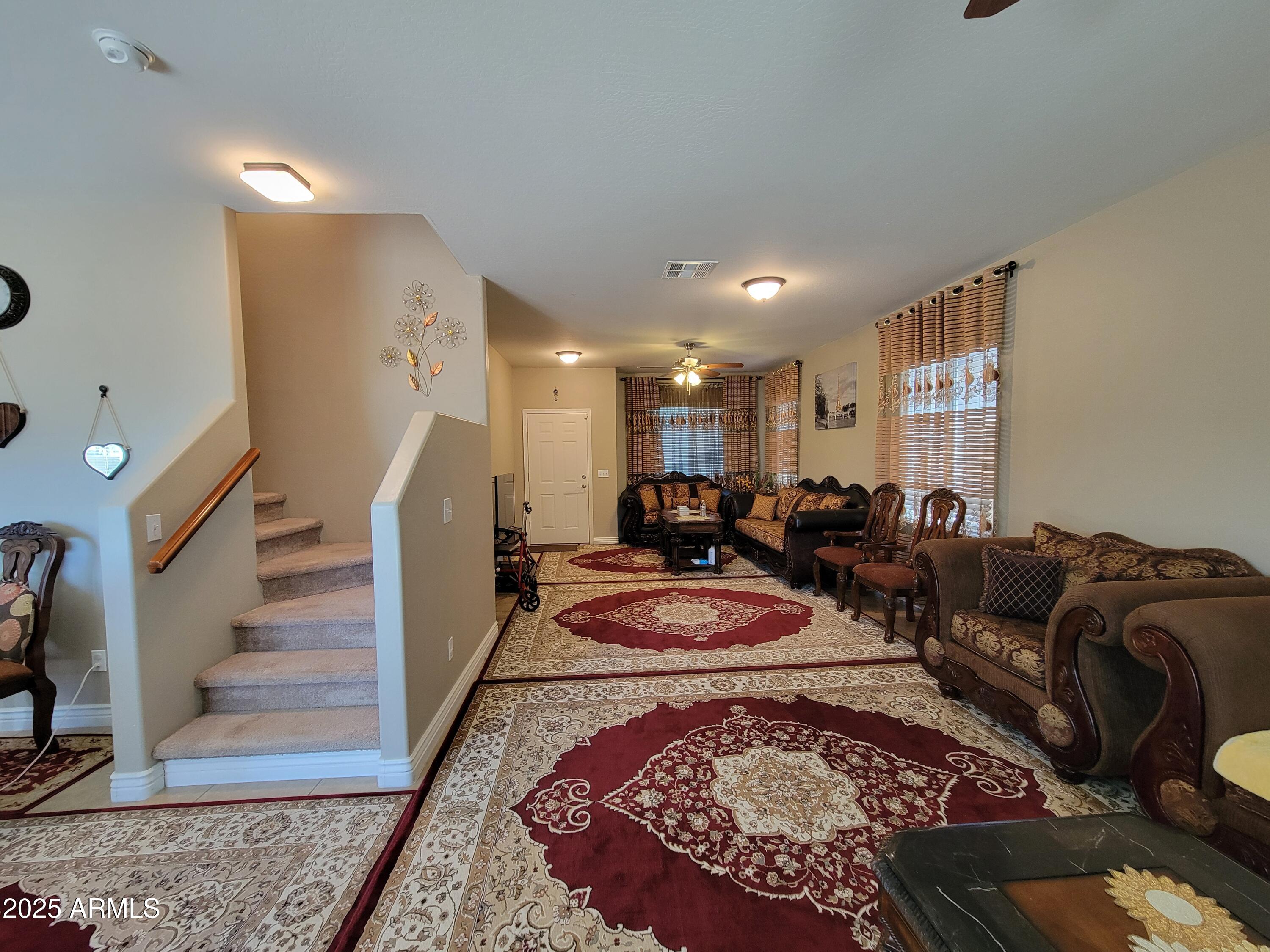 7439 West Wolf Street Phoenix, AZ 85033 - Photo 7 of 21 a bed room with furniture and a rug