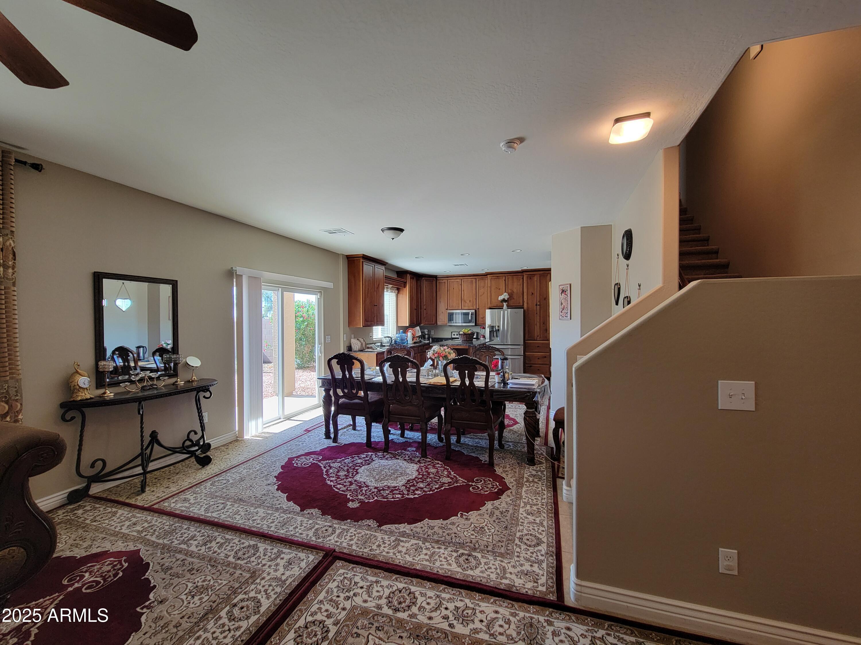 7439 West Wolf Street Phoenix, AZ 85033 - Photo 8 of 21 a living room with furniture and a dining table