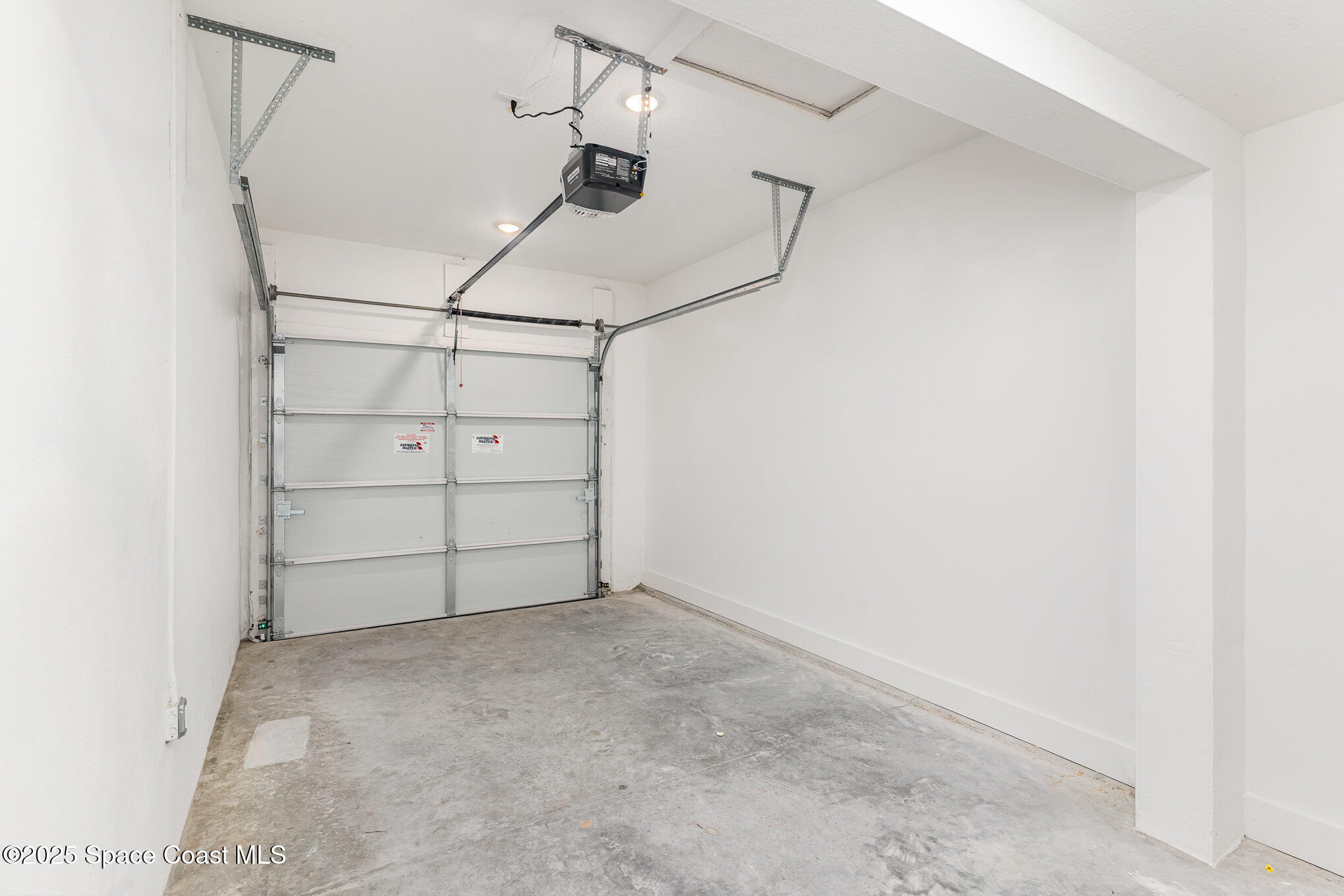 1635 Par Street Northeast, Unit 2103 Palm Bay, FL 32905 - Photo 26 of 36 a view of a room with racks on the wall