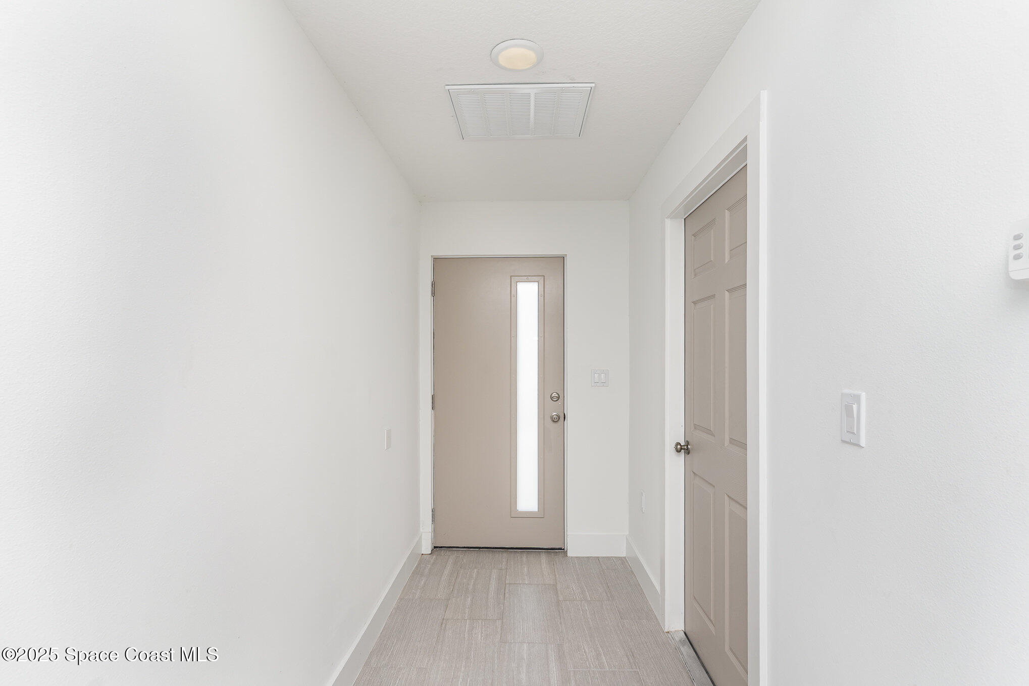 1635 Par Street Northeast, Unit 2103 Palm Bay, FL 32905 - Photo 3 of 36 a view of hallway with a large window