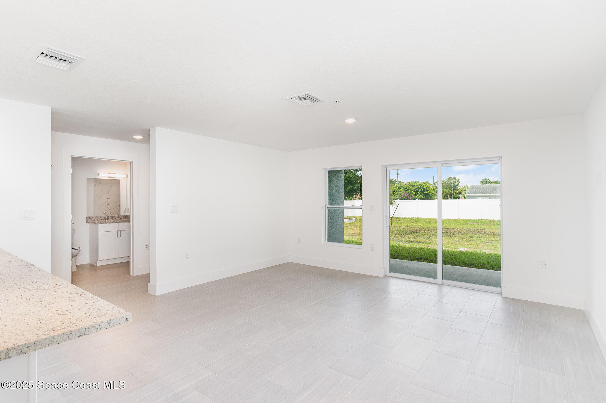 1635 Par Street Northeast, Unit 2103 Palm Bay, FL 32905 - Photo 4 of 36 a view of an empty room with a window