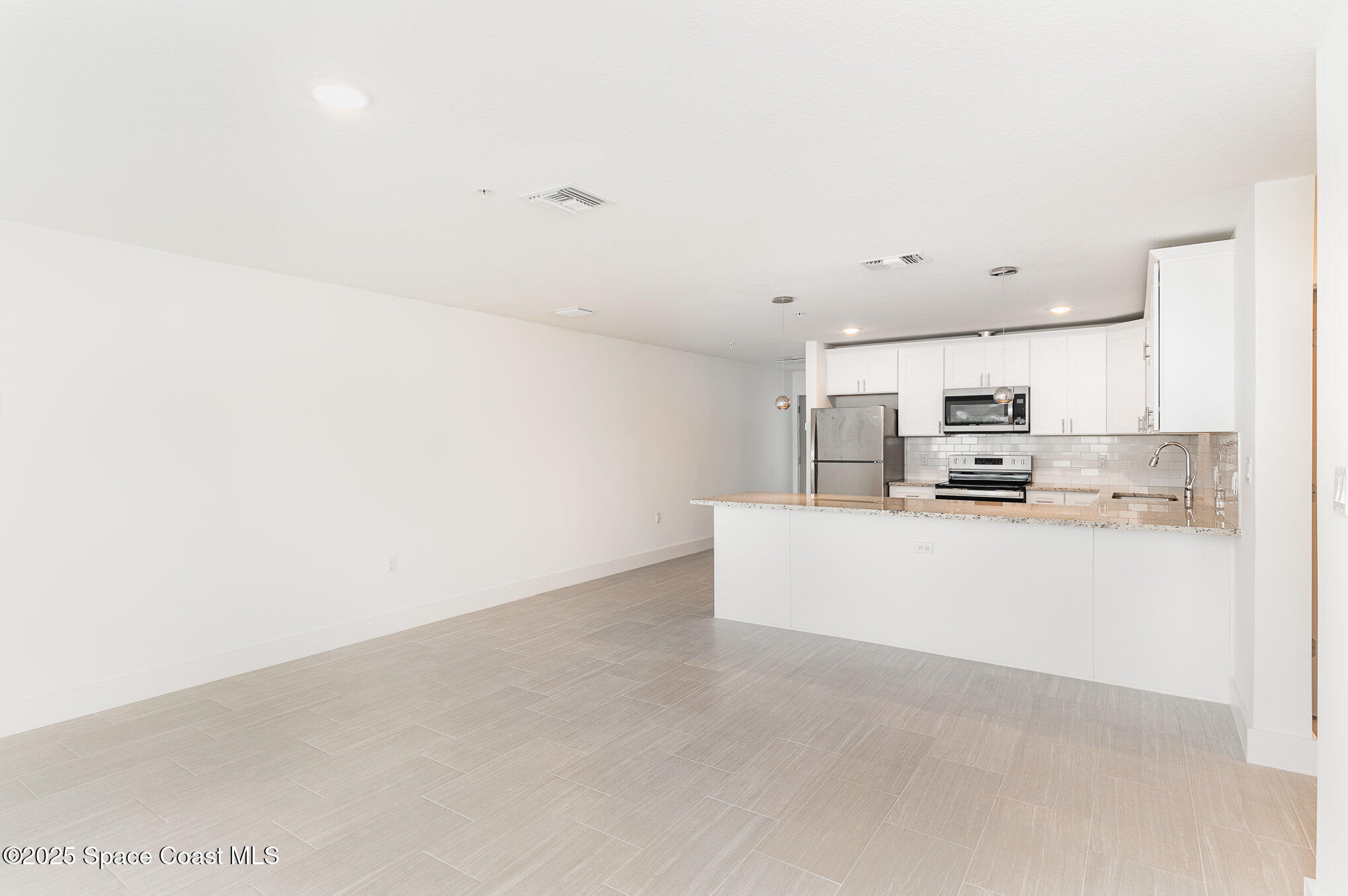1635 Par Street Northeast, Unit 2103 Palm Bay, FL 32905 - Photo 6 of 36 a view of kitchen with stainless steel appliances