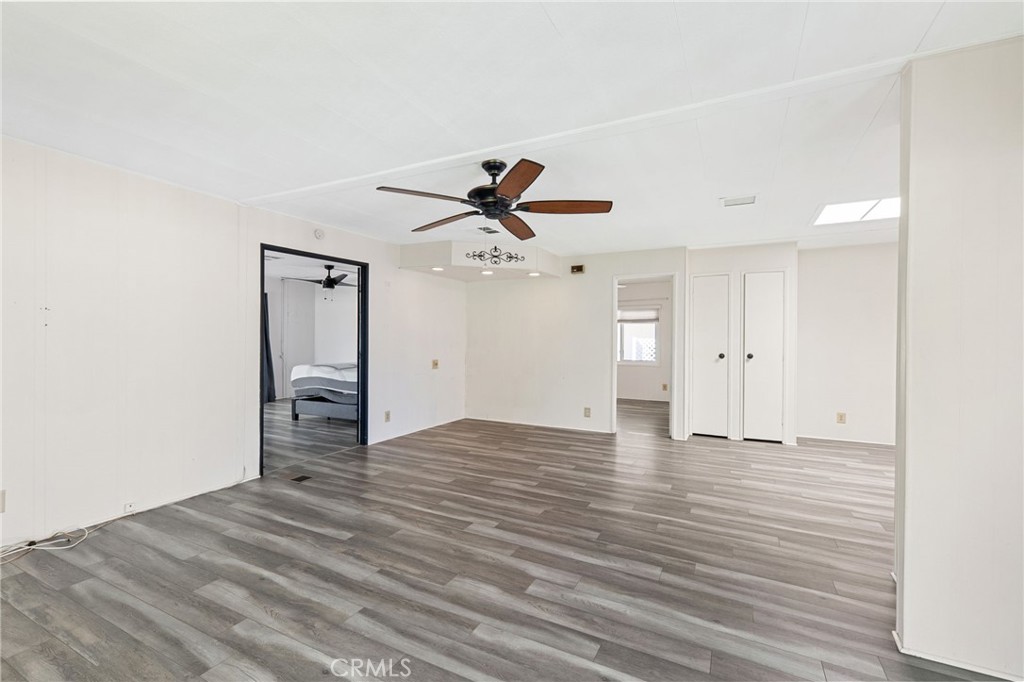 27701 Murrieta Road, Unit 227 Menifee, CA 92586 - Photo 15 of 36 a view of empty room with wooden floor and ceiling fan
