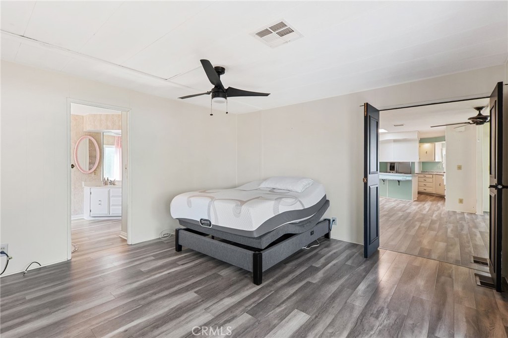 27701 Murrieta Road, Unit 227 Menifee, CA 92586 - Photo 17 of 36 a living room with furniture and a wooden floor