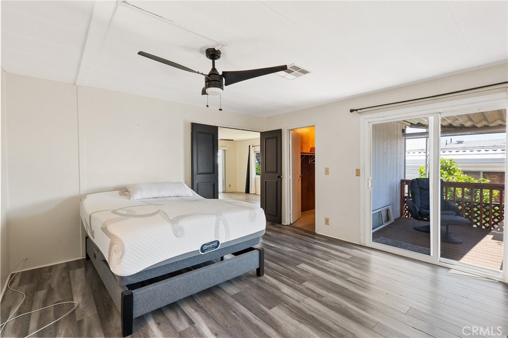 27701 Murrieta Road, Unit 227 Menifee, CA 92586 - Photo 19 of 36 a large bed sitting in a spacious bedroom next to a window