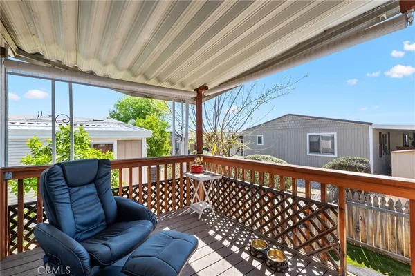 a view of a balcony with furniture