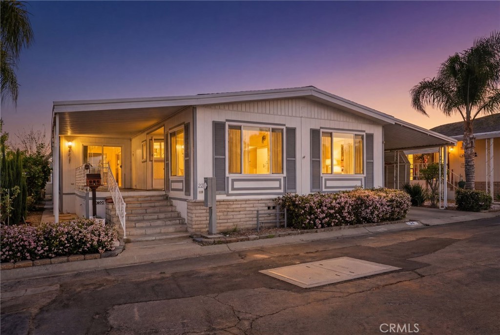 27701 Murrieta Road, Unit 227 Menifee, CA 92586 - Photo 2 of 36 a front view of a house with a yard