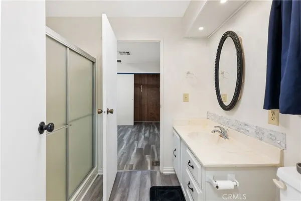 a bathroom with a double vanity sink and a mirror