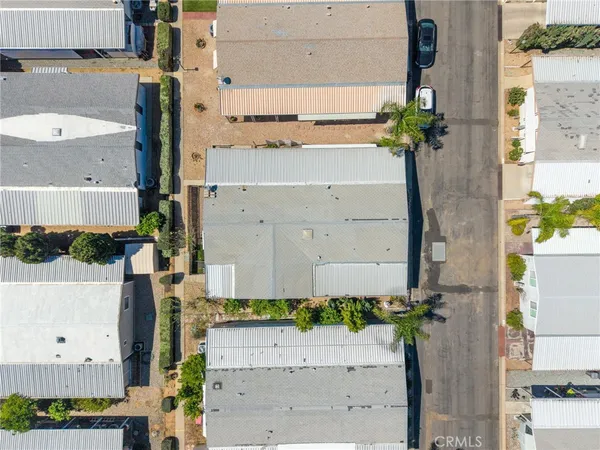 view of rooftop and yard