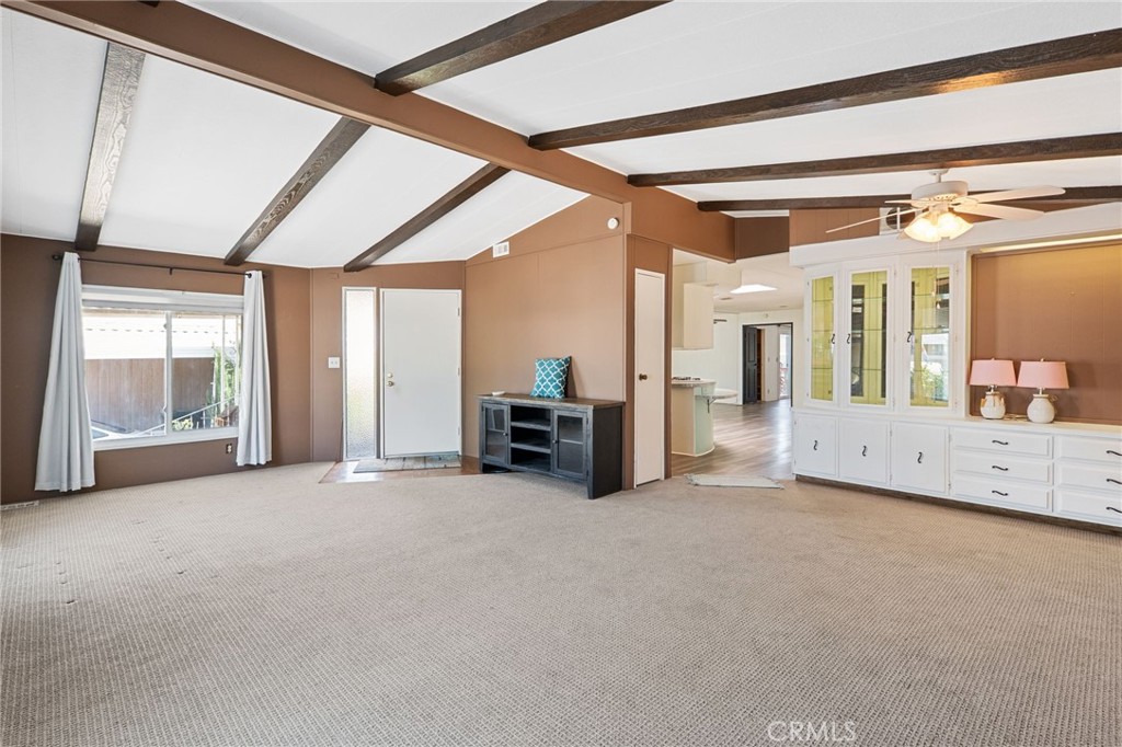 27701 Murrieta Road, Unit 227 Menifee, CA 92586 - Photo 6 of 36 a view of an empty room with a fireplace and a window