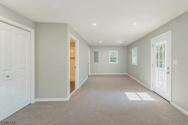 a view of room with hardwood floor and window
