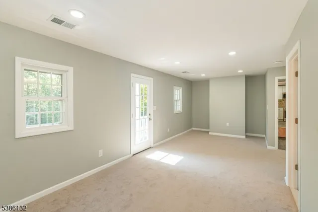 a view of empty room with windows