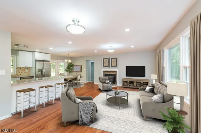 a living room with fireplace furniture and a flat screen tv