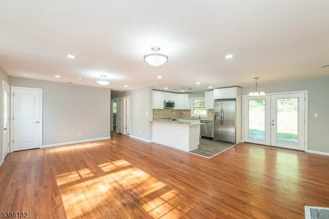 a view of kitchen with wooden floor
