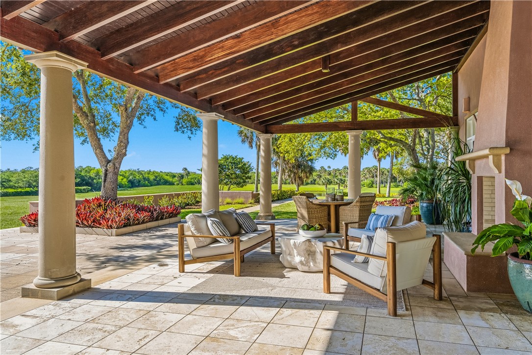 2350 Quay Dock Road Vero Beach, FL 32967 - Photo 5 of 35 a building outdoor space with patio furniture and potted plants