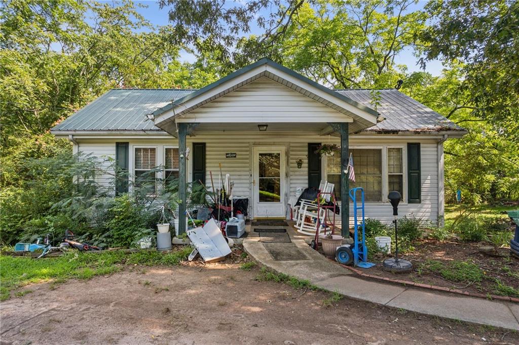 3804 Price Road Gainesville, GA 30506 - Photo 1 of 7 a front view of a house with a yard and porch