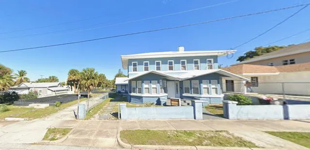a view of a swimming pool with a lounge chairs