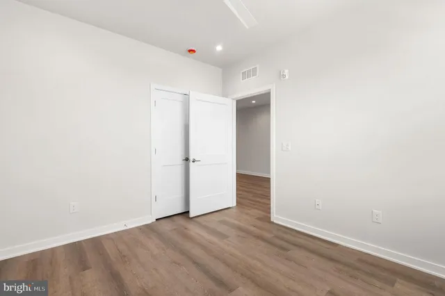 a bathroom with a double vanity sink toilet and shower