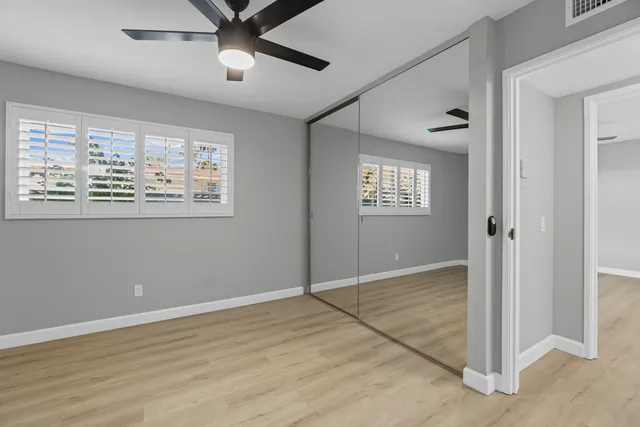 a view of a hallway with washer and dryer