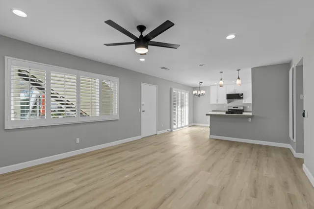 a view of a kitchen with a sink and a window