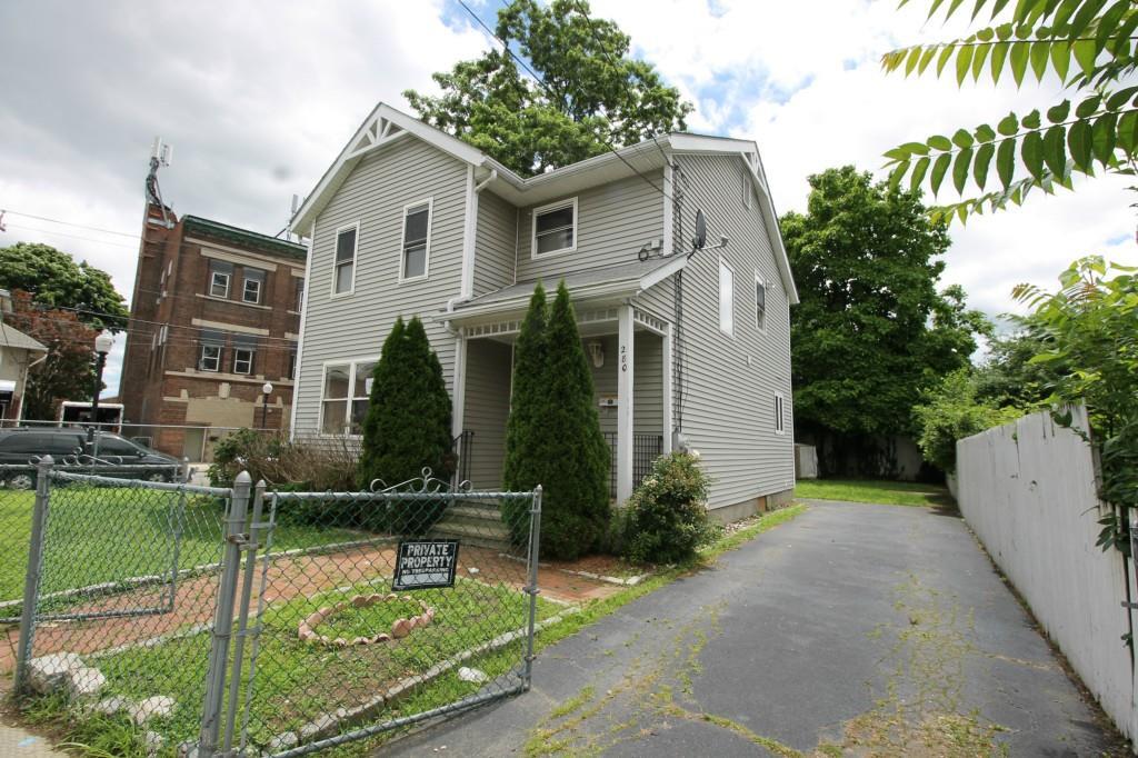 280 Beardsley Street Bridgeport, CT 06607 - Photo 1 of 1 a front view of a house with a yard