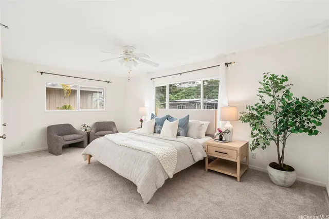 a bedroom with bed and a couch