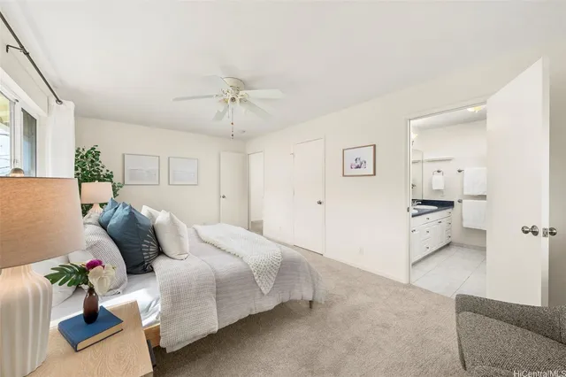 a spacious bedroom with a bed and a couch