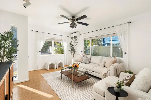a living room with furniture and a large window