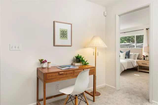 a workspace with furniture and a window