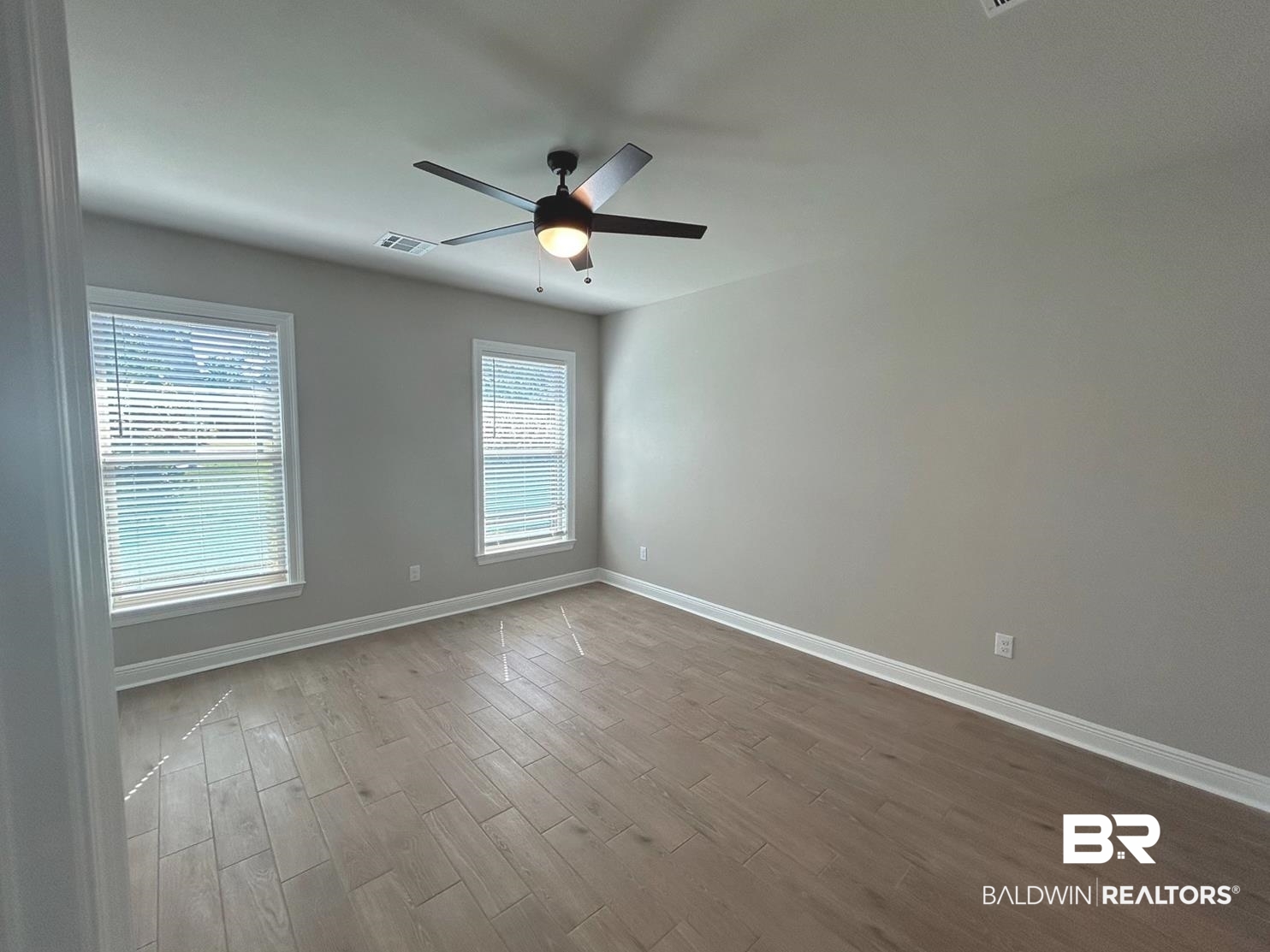 848 Sumter Loop Foley, AL 36535 - Photo 5 of 16 Spare room featuring light hardwood / wood-style flooring and ceiling fan