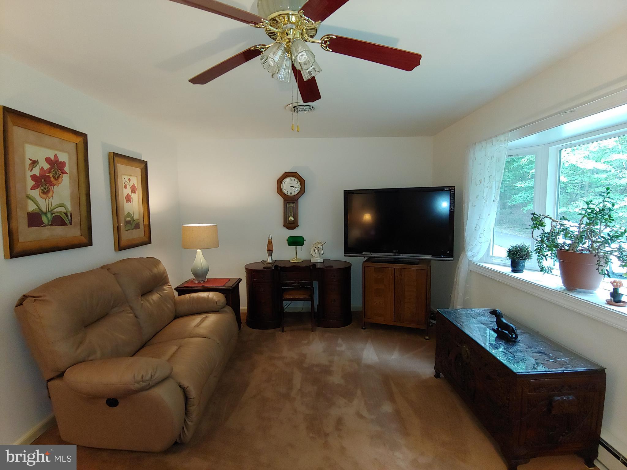 1629 Old Elk Neck Road Elkton, MD 21921 - Photo 6 of 36 Living room with ceiling fan & light attachment