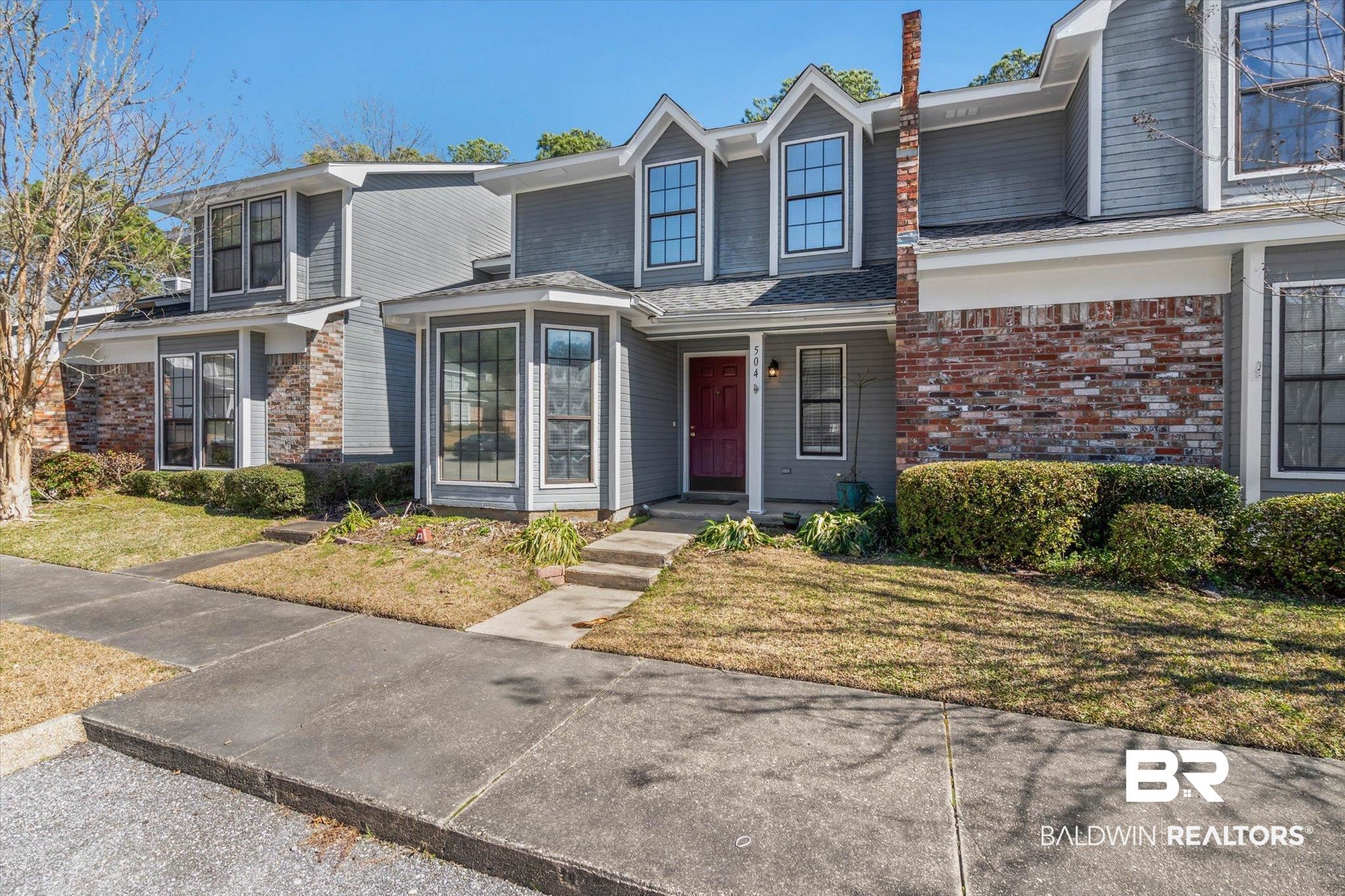 5900 Grelot Road, Unit 504 Mobile, AL 36609 - Photo 20 of 24 View of front facade featuring a front yard